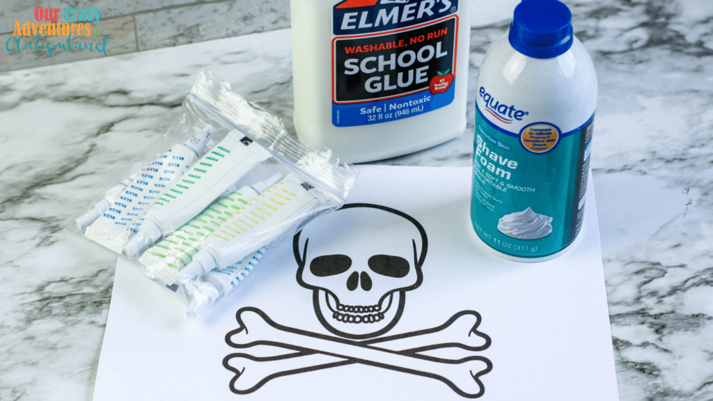 Jolly Roger outline, food coloring, bottle of glue, can of shaving cream